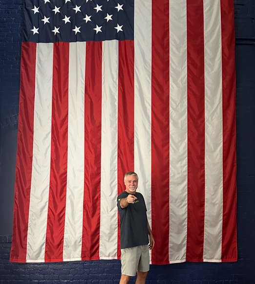 Robb Carter with an American flag