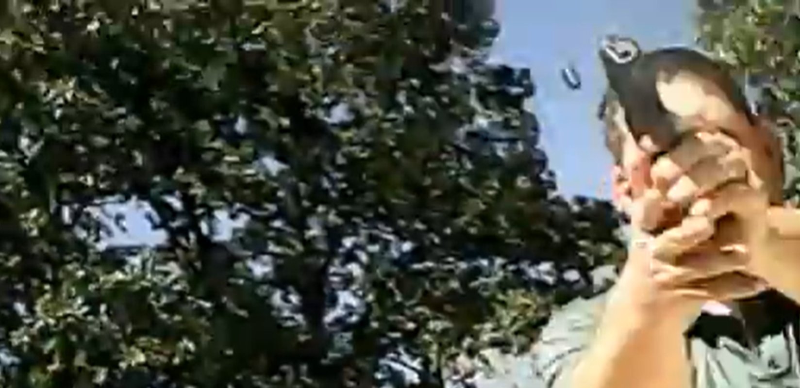 A frame from Jeffrey Weinhaus’s watch camera video shows a Missouri State Highway Patrol trooper aiming his handgun during the September 11, 2012 encounter near St. Clair. A spent casing is visible in the air above the trooper.